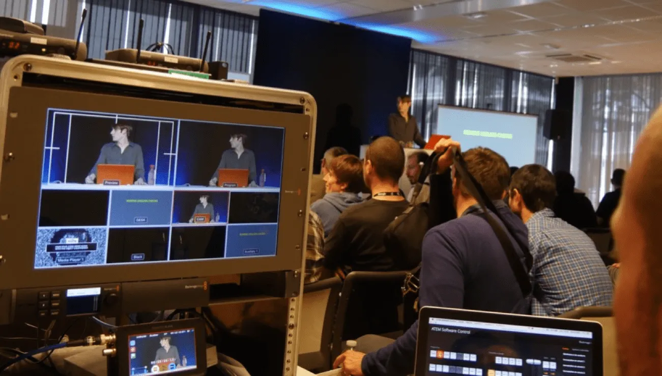 Maxence presenting a technical talk to a conference audience